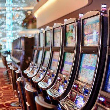 Slot machines inside a casino against a blurred background