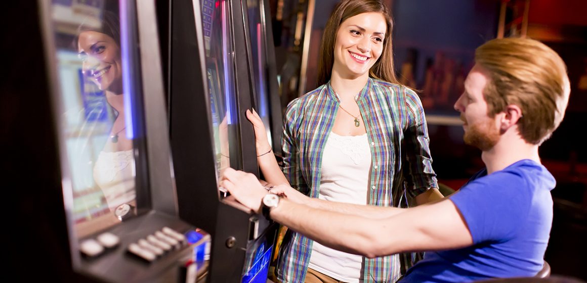 Young Couple at a Slot Machine