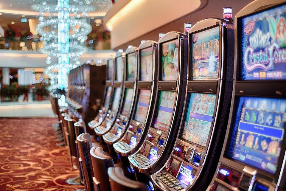 Slot machines inside a casino against a blurred background