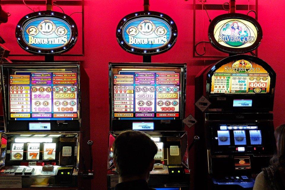 People playing at slot machines in a casino
