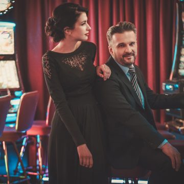 Couple Playing Slots in a Casino