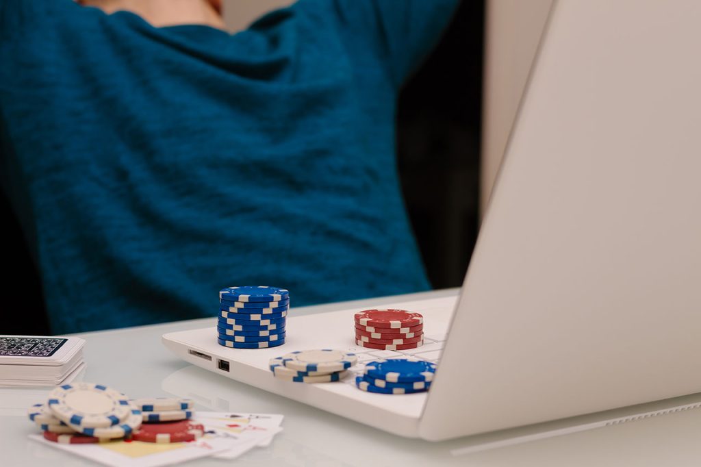  A laptop with casino chips