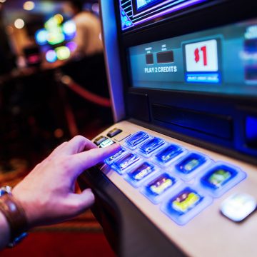 Man Playing a Slot Machine