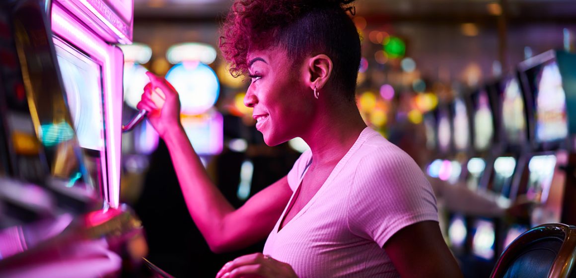 A happy woman playing slots
